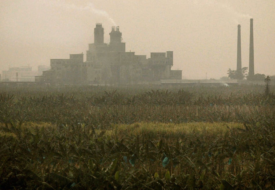 It's not uncommon to see industrial plants and factories border crop fields and rivers.